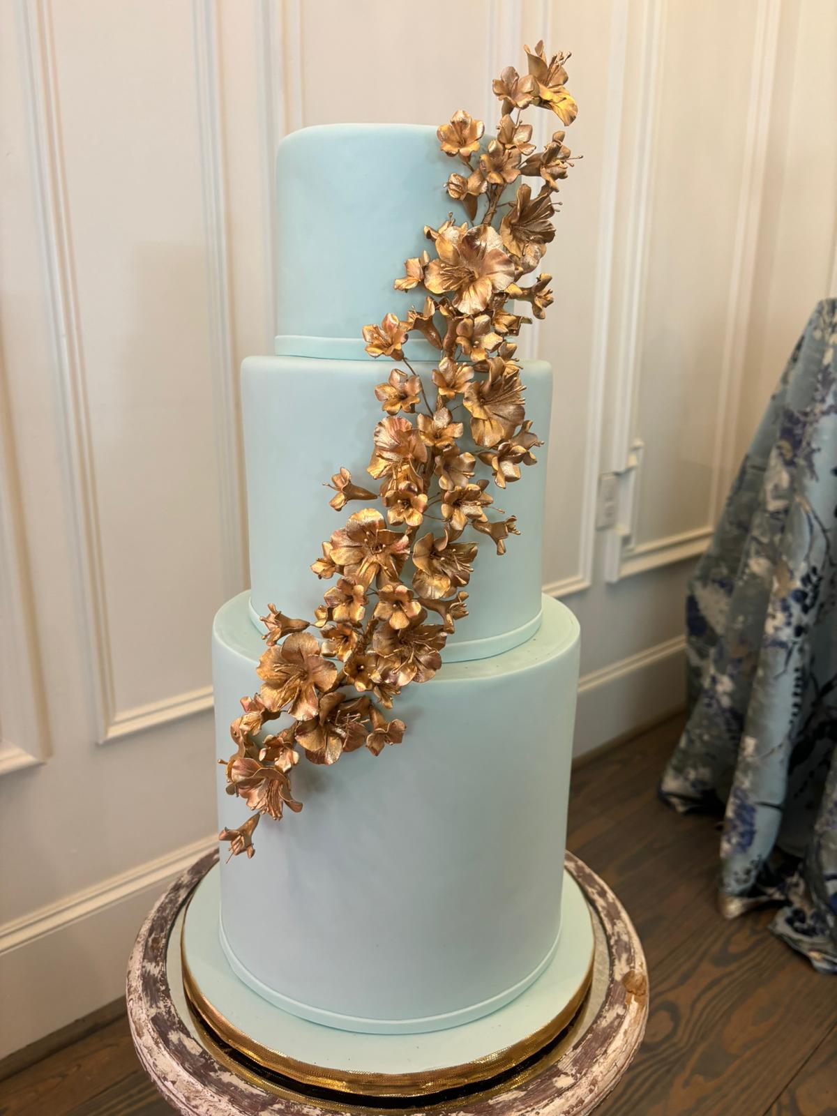 Wedding Cake. Dusty blue. Gold Sugar Flowers